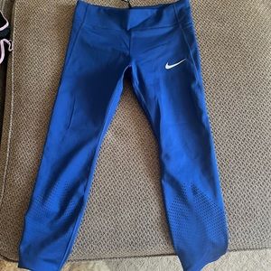 Nike dry fit spandex capri. Blue in color hits right above the ankle.